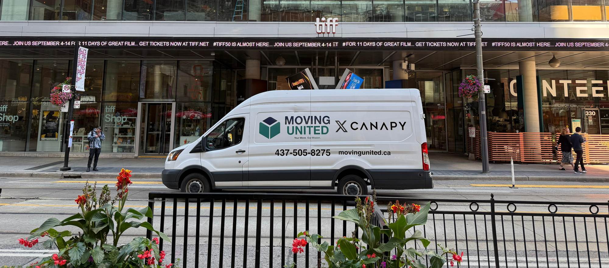 The Moving United van, co-branded with Canapy, parked on King Street West outside TIFF Lightbox in Toronto